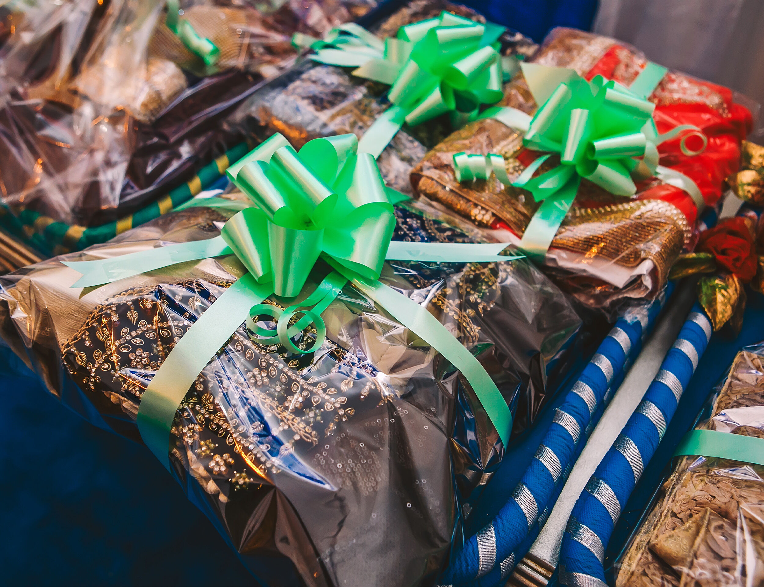 Beautifully packed gift package containing different colored sarees, a perfect wedding present for the bride.